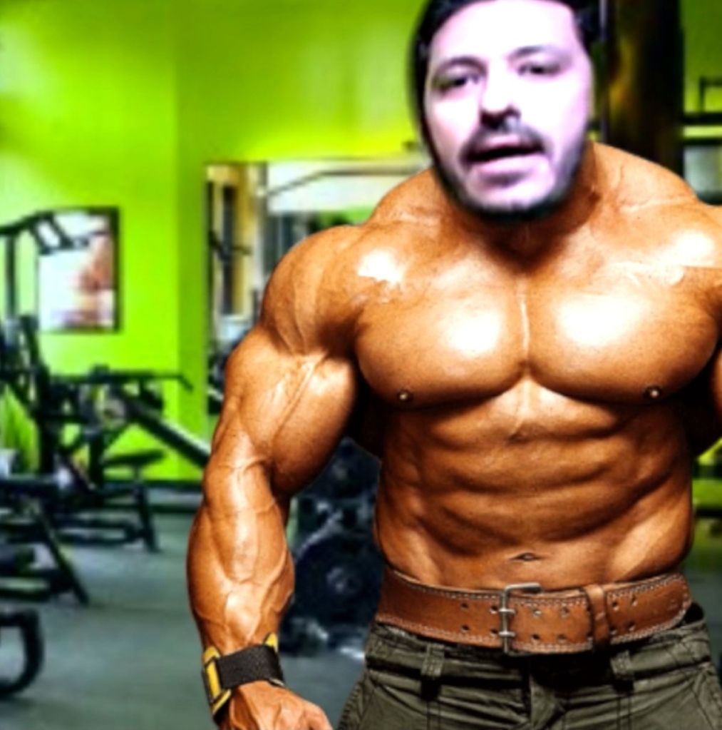 Ask Me a Question — Bassem Yousri performing behind an AI filter that swaps his image for a bodybuilder's, interactive multimedia performance, Goethe Institute, Cairo, 2022